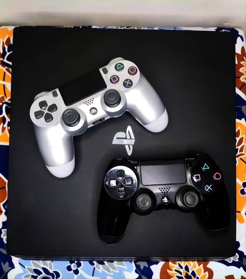 Ps4 pro 1 TB 2 controllers 6 month ps plus primary Gta 5 downloaded m 13