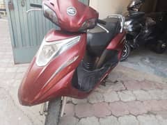 united 100cc self start scooty