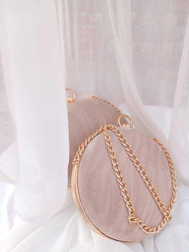 women's round shimmery clutch 3