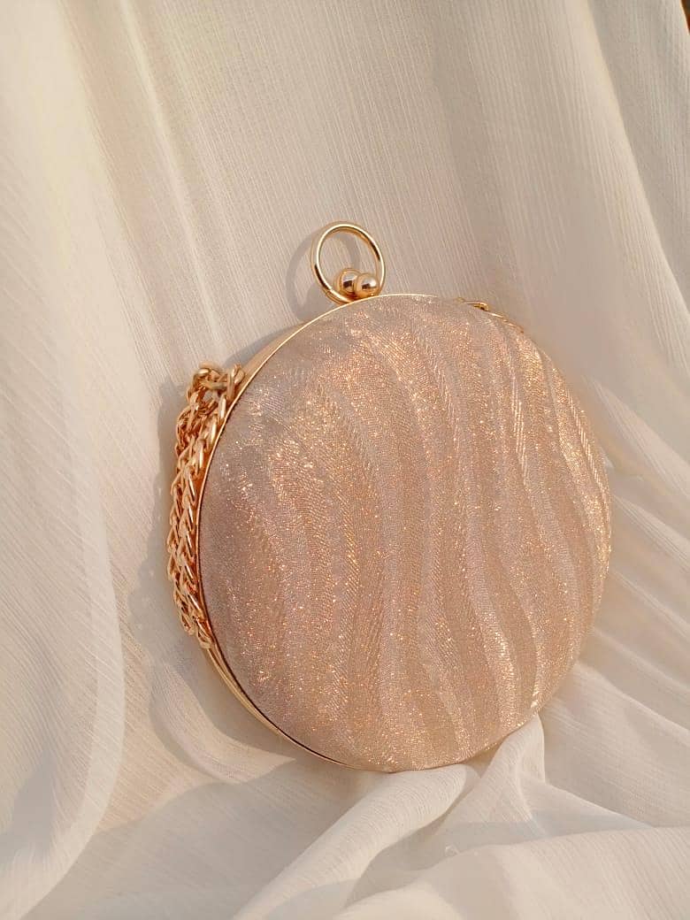 women's round shimmery clutch 5