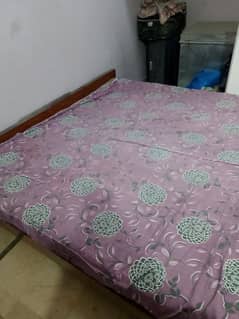 king size wooden bed with mattress