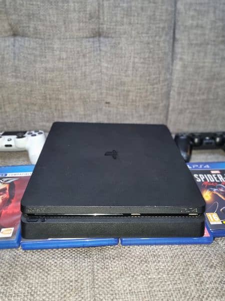 Sony PlayStation 4, PS4 Slim 1TB, with 6 games, 2 controllers 1