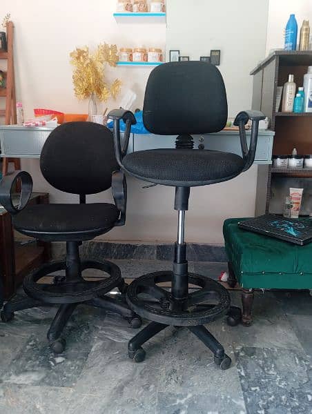 2 office chairs available urgent for sale . 1