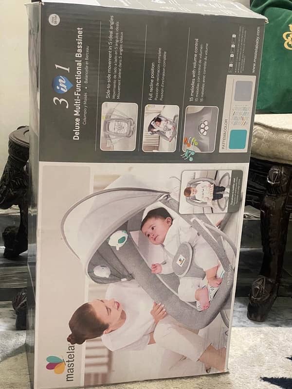 Deluxe Multi functional bassinet Electric Rocker. 1