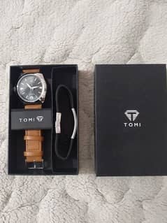 original TOMI watch with one original TOMI hand band + Box pack