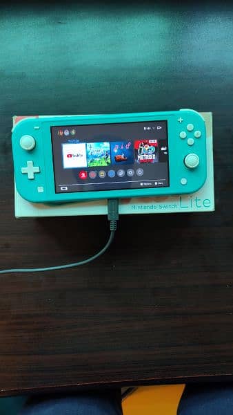 Nintendo switch lite ( complete box + 2 games ) 1