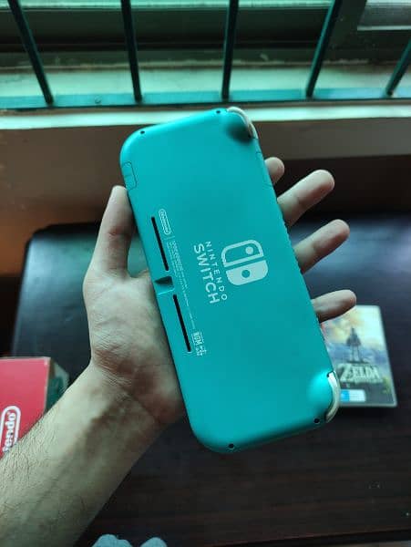 Nintendo switch lite ( complete box + 2 games ) 2