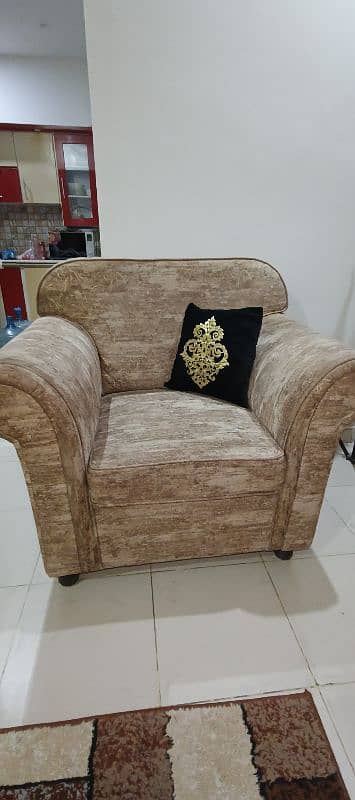 Urgent sell 7 seater sofa set with free wooden table and cushions 1