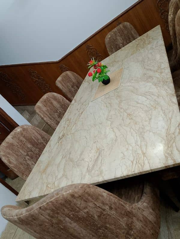 Marble dining table with 8 comfortable turkish cloth chairs. 2