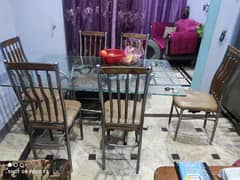 Glass dining table with 6 steel chairs