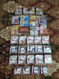 ORIGINAL TAKARA TOMY BEYBLADES AND LONCHERS