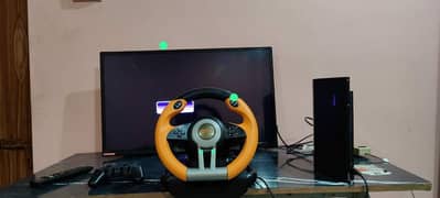 playstation 3 with steering and pedals