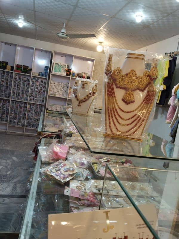 4 shops full boutique with jewelery,clothes and lace button garments 11