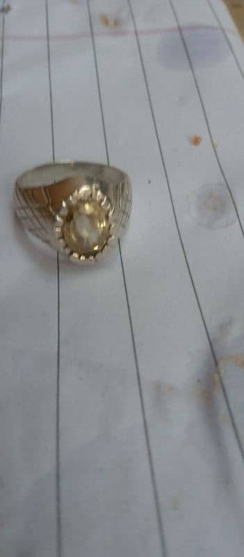 stone natural pukhraj salon wala ring chandi ki bani Hui hai 10