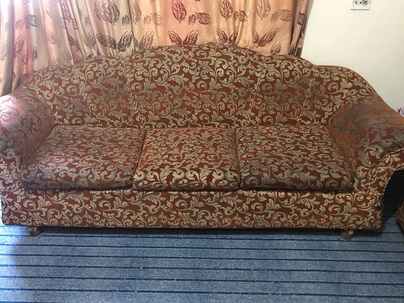 Sofa set of red color along with cream flower design 0