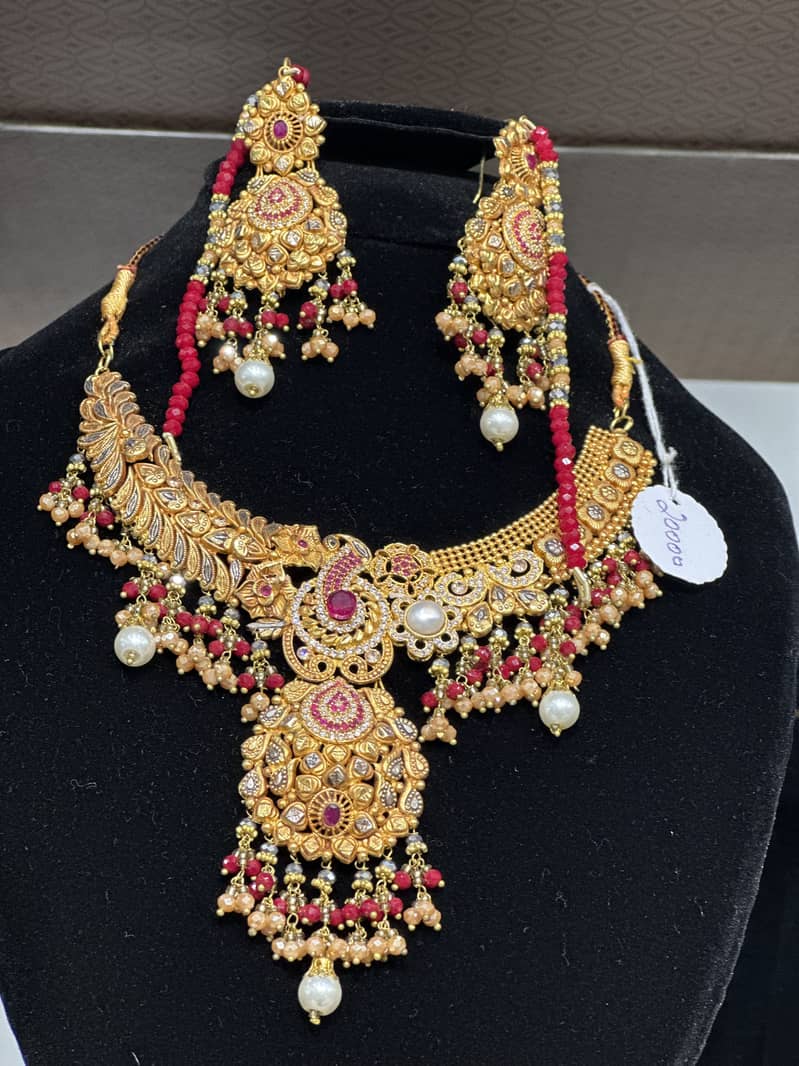 Artificial with 2 karat gold plated 9