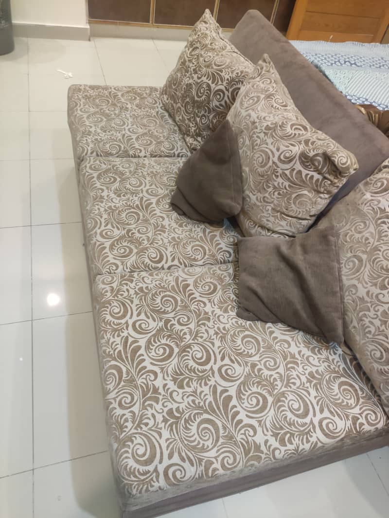 L-shaped sofa golden colour 1