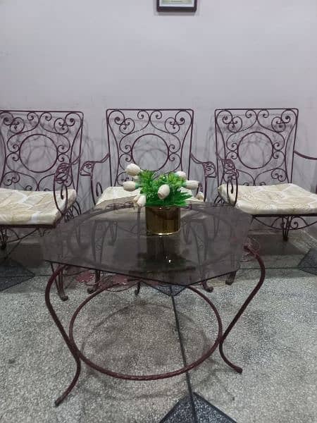 5 chairs and 1 round table with glass top 0