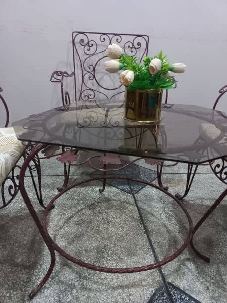 5 chairs and 1 round table with glass top 2