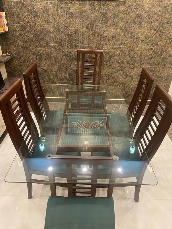 wooden dinning table 6 seater with moltyfoam seats 4