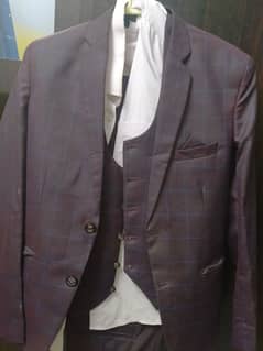 Three piece suit in used condition