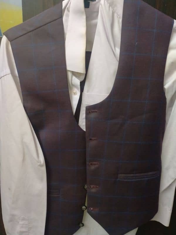 Three piece suit in used condition 1