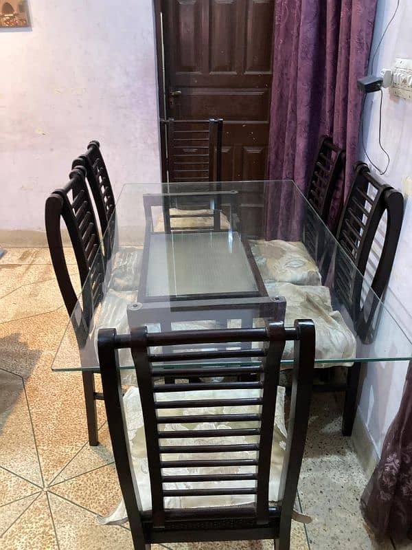 Iam selling Dining table of 6 chairs same as new and one centre table 5