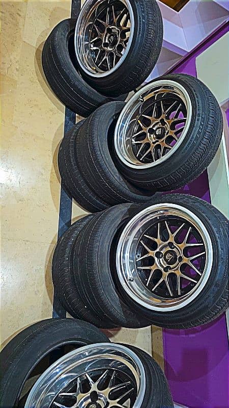 Deep diss 15 inch 9. jj 100 pcd 4 nut rims with tires 5