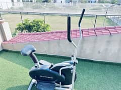 Elliptical, dumbbells with rack and weight plates with rod