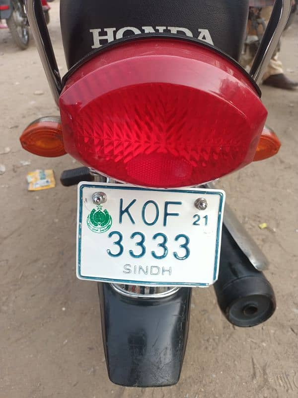 Honda 125 Karachi golden num red colour 2