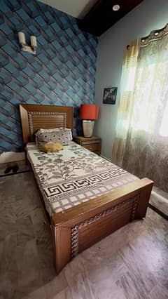 single bed with side table and molty foam