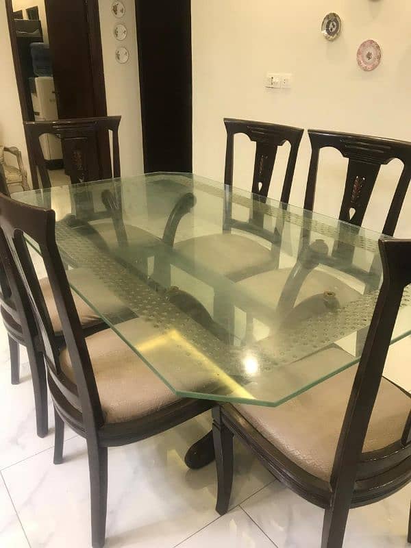 Glass top dining table with 6 chairs for 40k. 3