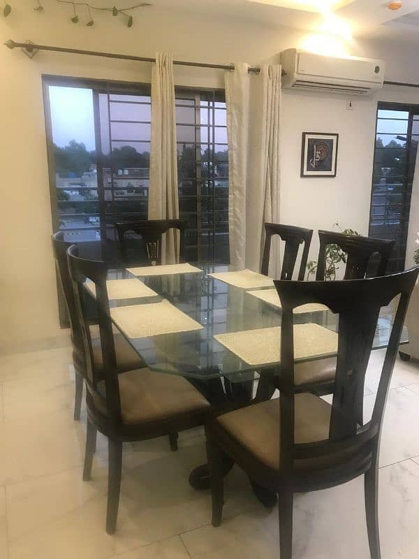 Glass top dining table with 6 chairs for 40k. 4