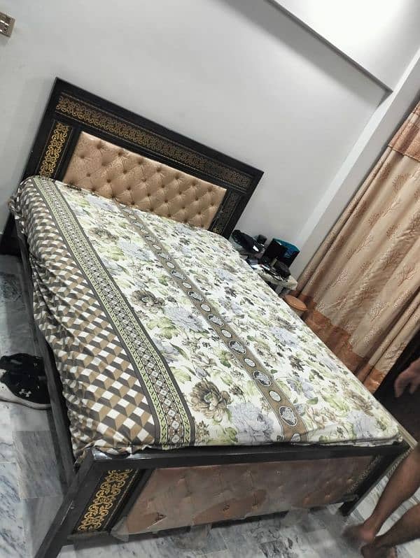 good condition rod iron bed with mattress 1