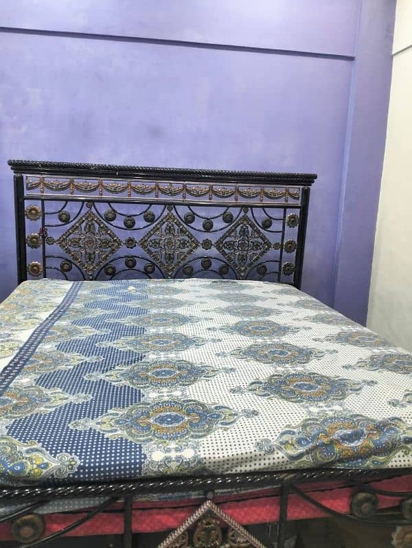 good condition rod iron bed with mattress 4