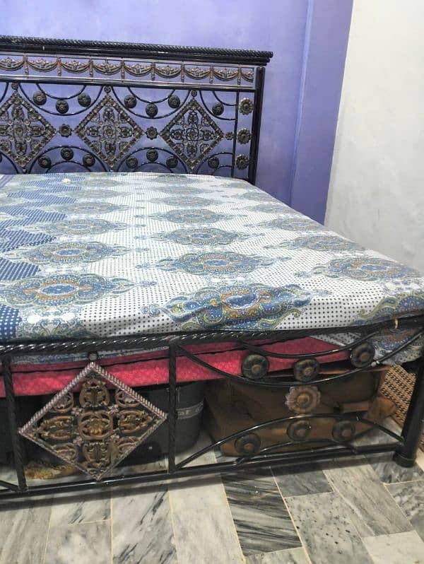 good condition rod iron bed with mattress 5