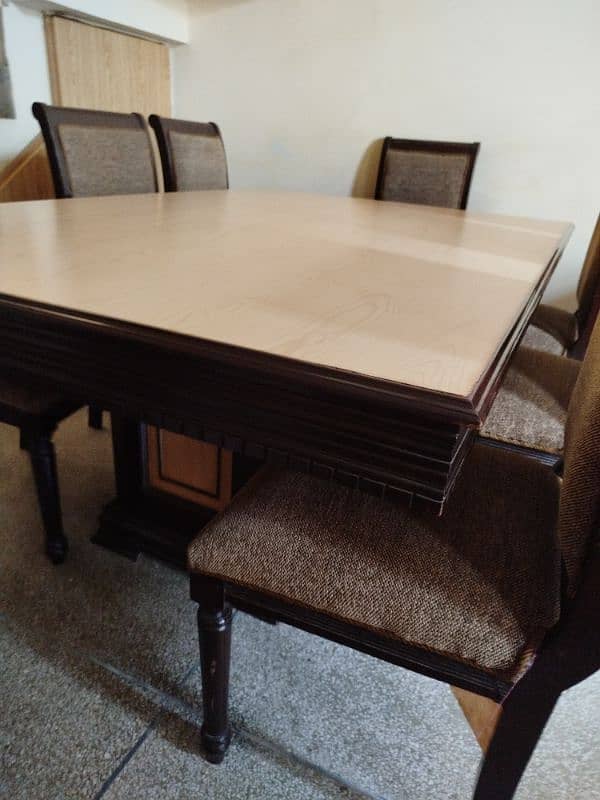 wooden compressed Formica table with eight cushioned chairs 5