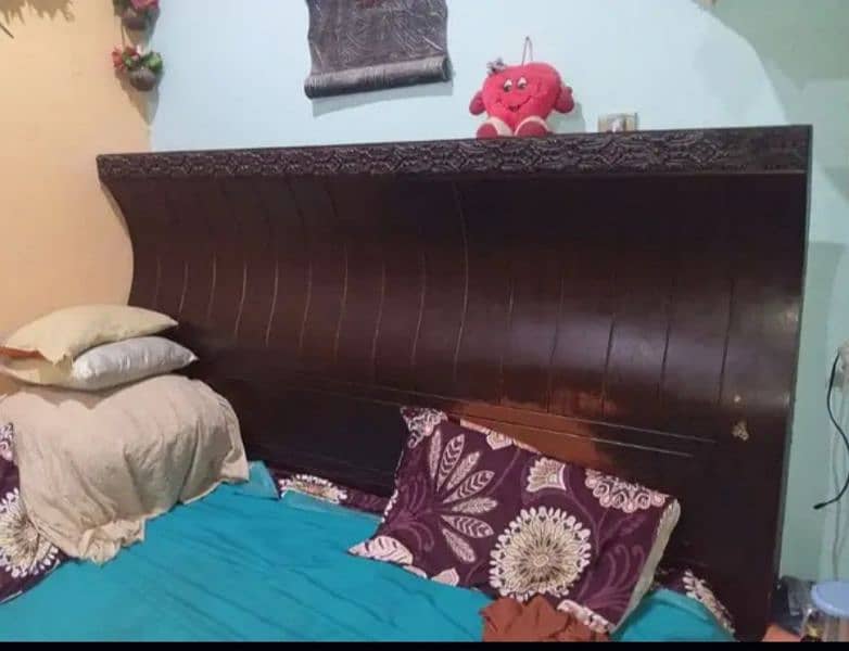 wooden bed good condition 0