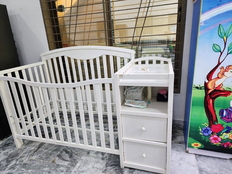 A WOODEN KIDS BED WITH DRAWERS 1