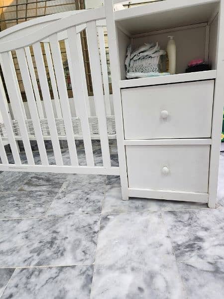 A WOODEN KIDS BED WITH DRAWERS 2