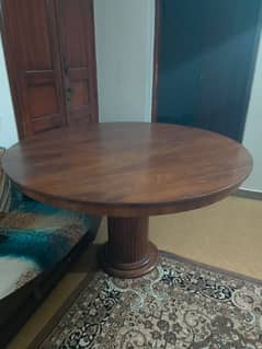 Round wooden dining table with 4 chairs