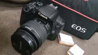 Canon 700D DSLR camera with 18-55mm lens , 2 batteries, and bag