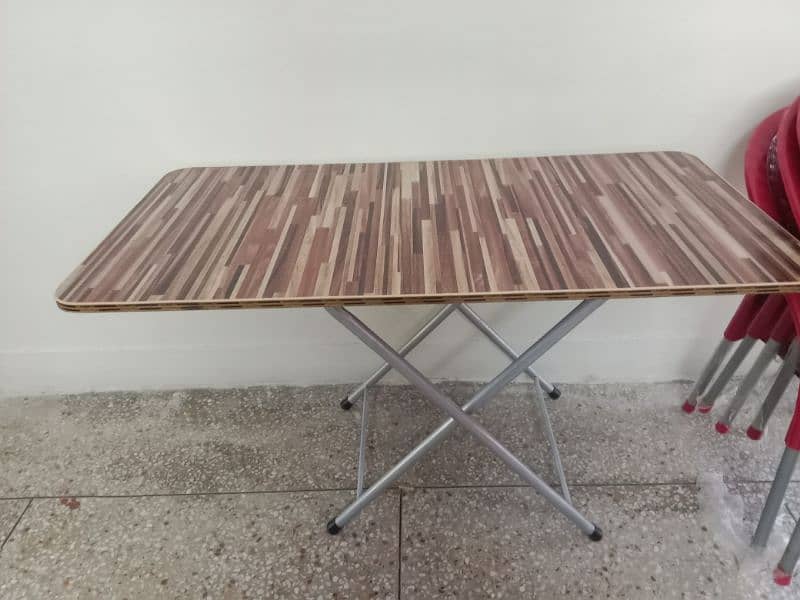 wooden table with 6 plastic chairs 1