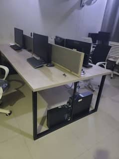 worstation with computer setup and chairs