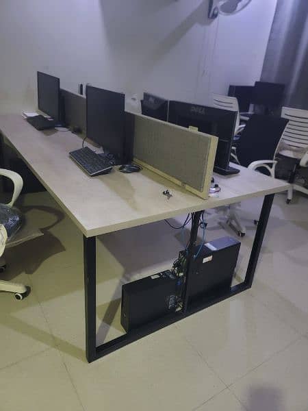 worstation with computer setup and chairs 0