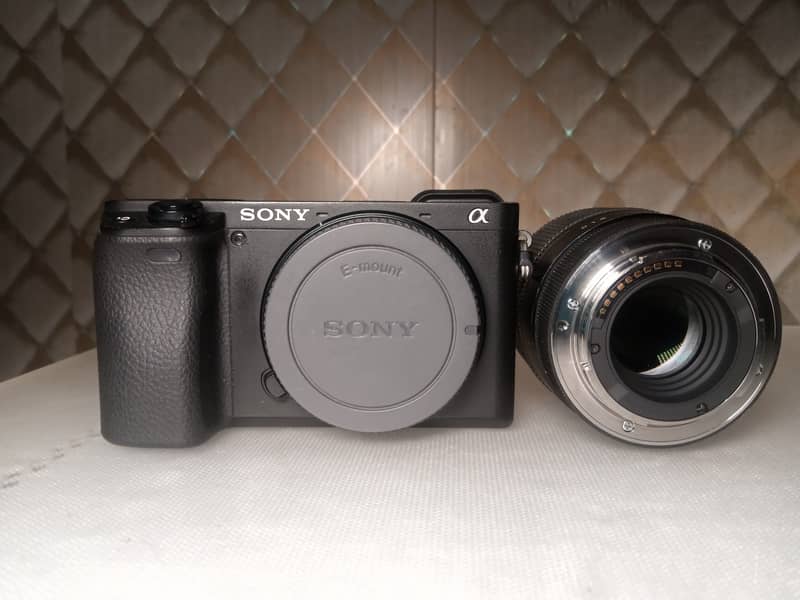 camera sony a6400 with sigma 30mm & sony 16mm 8