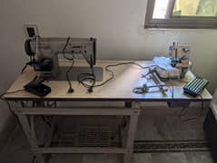 juki TL-82 Sewing machine with overlock machine on a wooden stand. 0