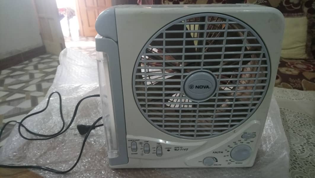 Table fan with builtin radio/emergency light 1