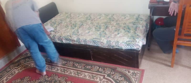 two single bed along with mattress and one side table 1