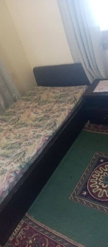 two single bed along with mattress and one side table 2